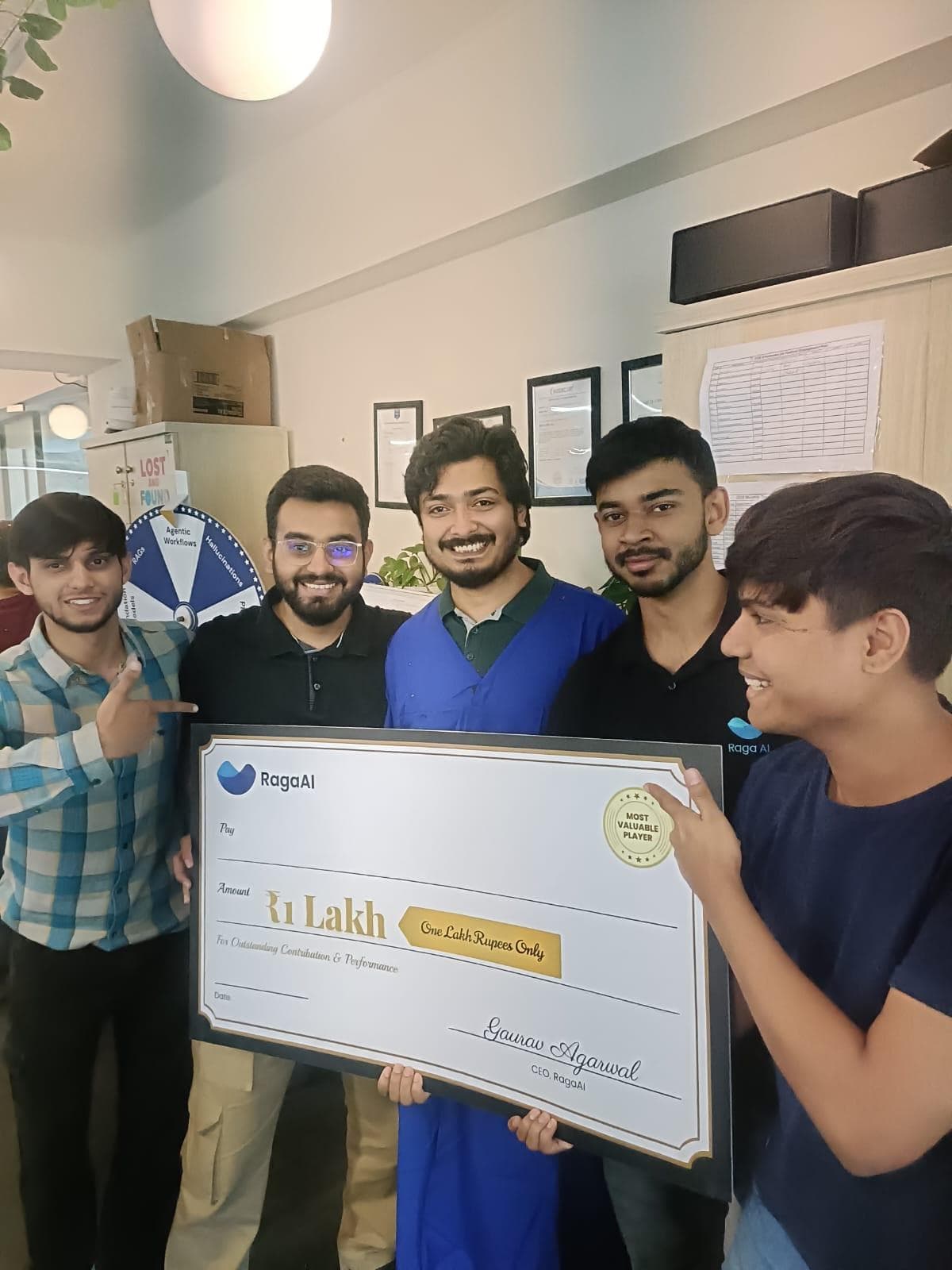 Sachin Kamat celebrating the Q1 2026 MVP award with teammates